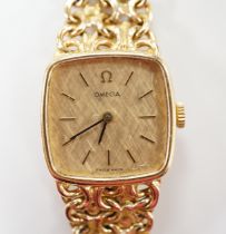 A lady's 1970's 9ct gold Omega manual wind wrist watch, on integral Omega 9ct gold bracelet,