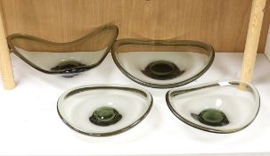 Four Holmegaard glass dishes, largest 39cm