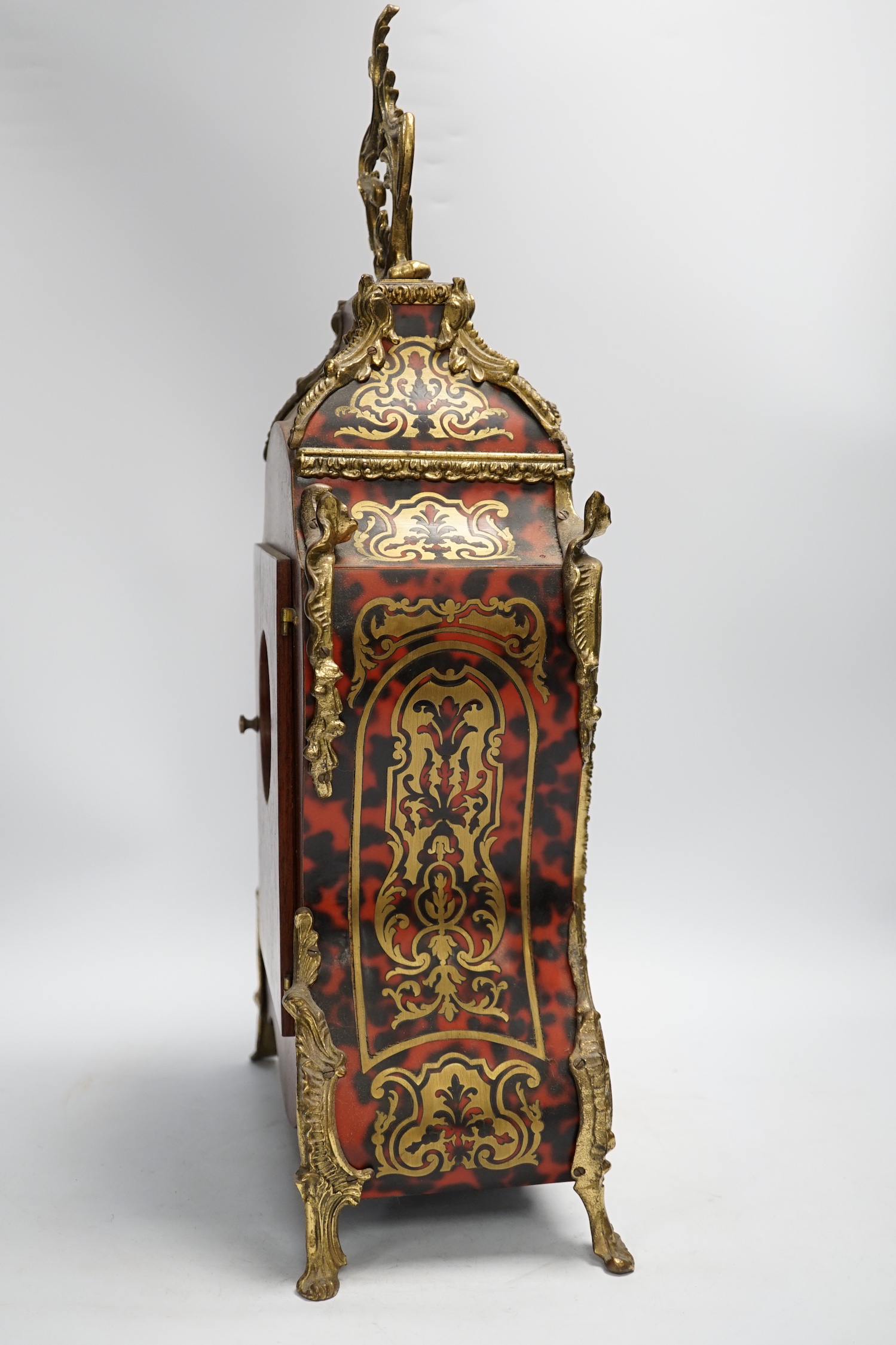 A simulated tortoiseshell Boulle work mantel clock, striking on a bell, 57cm high - Image 4 of 5