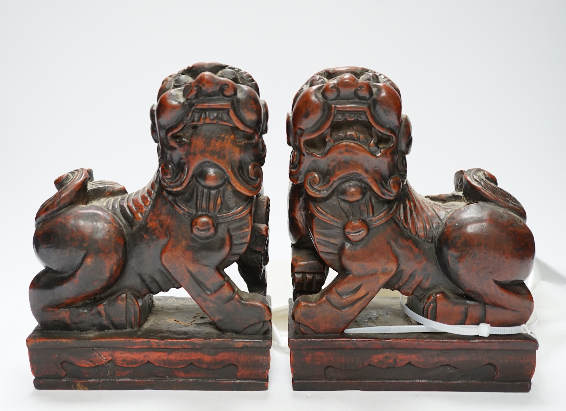 Two Japanese carved and lacquered hardwood Temple dogs, late Tokugawa period, 16cm wide