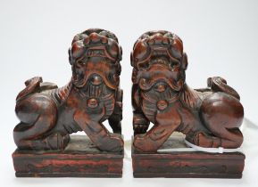 Two Japanese carved and lacquered hardwood Temple dogs, late Tokugawa period, 16cm wide