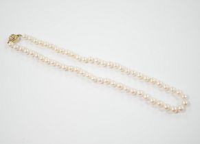 A single strand cultured pearl necklace with 18K and diamond chip set spherical clasp, 49cm.