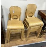 Seven 'Community Furniture' plywood chairs