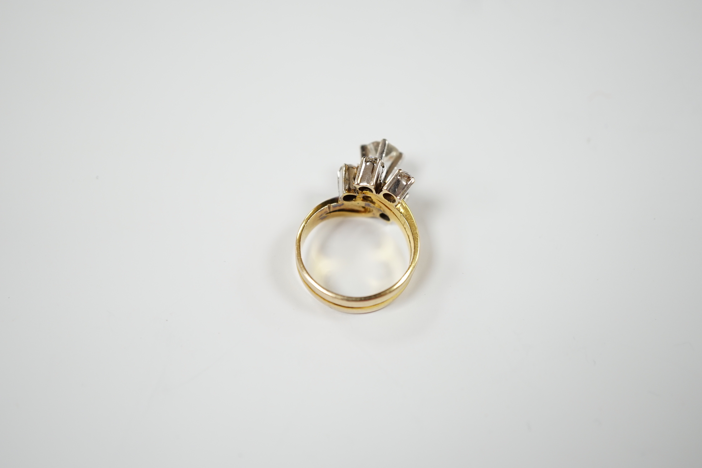 A yellow metal and graduated five stone diamond cluster set dress ring, in a raised setting, size - Image 4 of 4