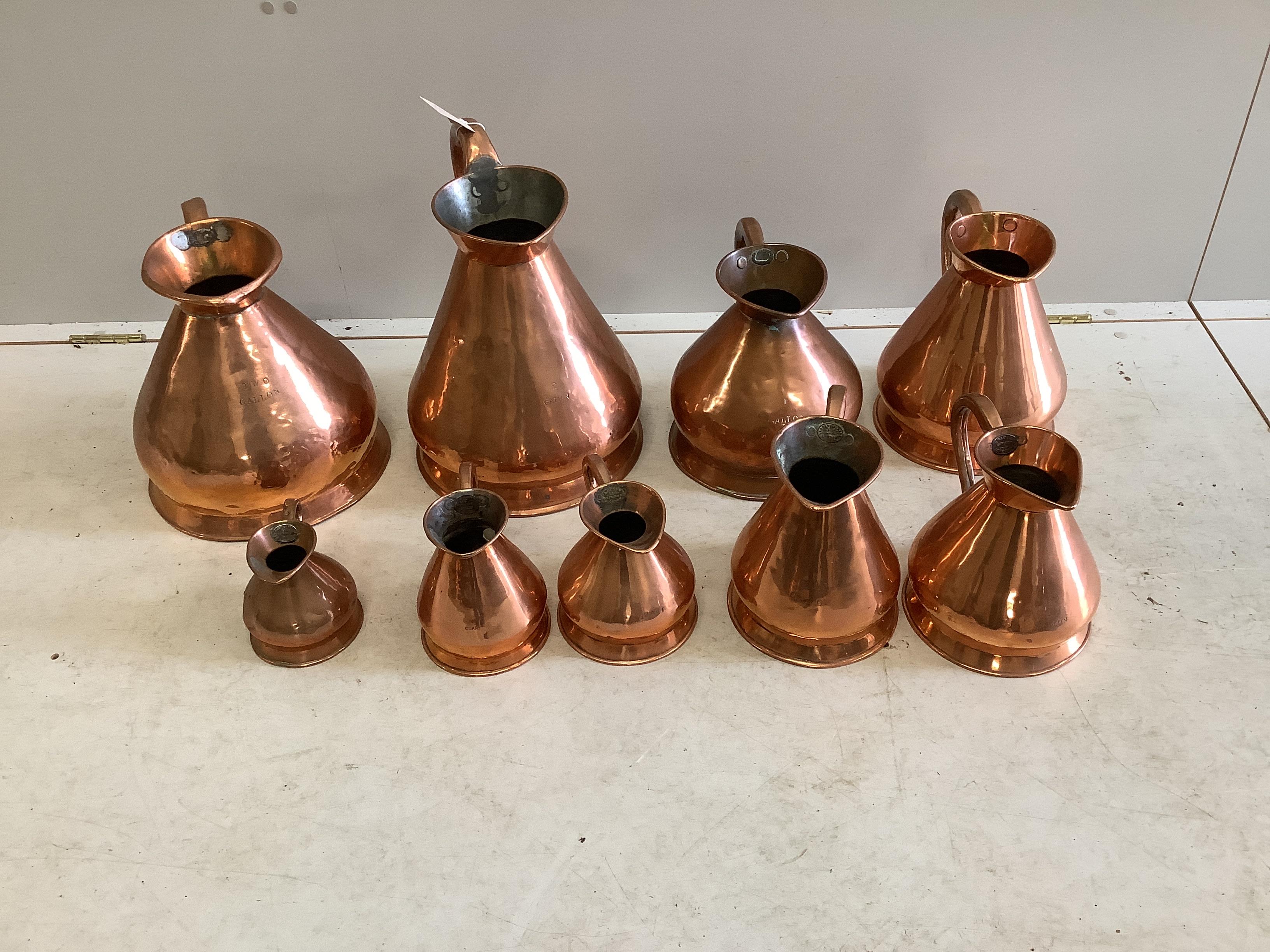 Nine 19th / early 20th century copper haystack measures, two gallons to one pint, largest height