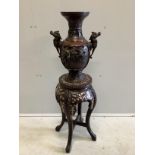 A Chinese circular marble topped vase stand, height 56cm together with a Japanese bronze two handled