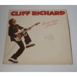 A signed Cliff Richard LP record album; Rock ‘n’ Roll Juvenile, EMC3307, signed in ballpoint ink