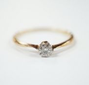A yellow metal and solitaire diamond set ring, size V, gross weight 2 grams.