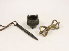 Three Chinese Tibetan metal wares including a miniature cauldron, a knife rest, etc.