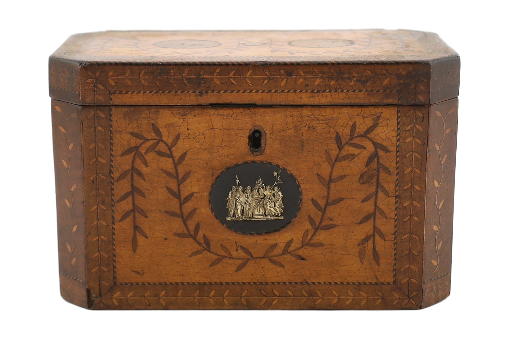 A George III Sheraton period marquetry inlaid sycamore tea caddy of octagonal form with foliate swag