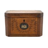 A George III Sheraton period marquetry inlaid sycamore tea caddy of octagonal form with foliate swag