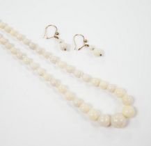 A single strand graduated white opal bead necklace, with 9ct clasp, 50cm and a pair of similar