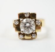 A 1970's 18ct gold and single stone diamond set ring, with five stone diamond mounted setting,