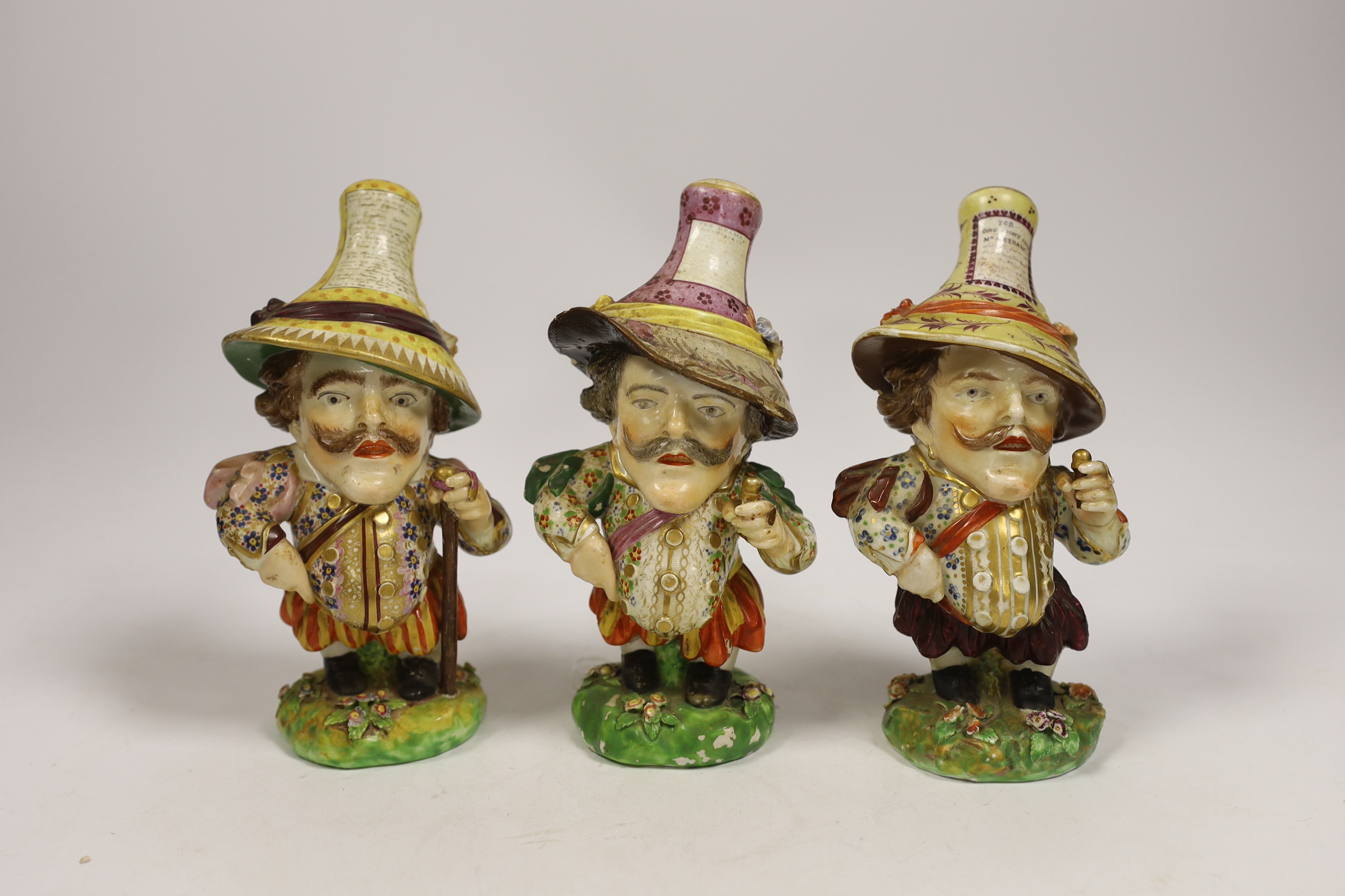 Three Derby porcelain Mansion House dwarves, c.1810-30, incised marks to the bases, 18cm high