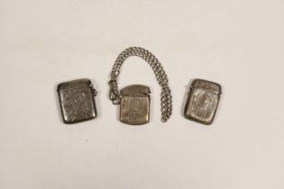 Three various silver vesta cases, together with a silver albert.