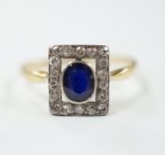 A yellow metal, sapphire and diamond cluster set tablet ring, size P, gross weight 2.3 grams.