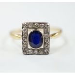 A yellow metal, sapphire and diamond cluster set tablet ring, size P, gross weight 2.3 grams.