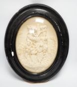 A pair of framed plaster ovals of the Madonna and Child with John the Baptist and the 'Descent