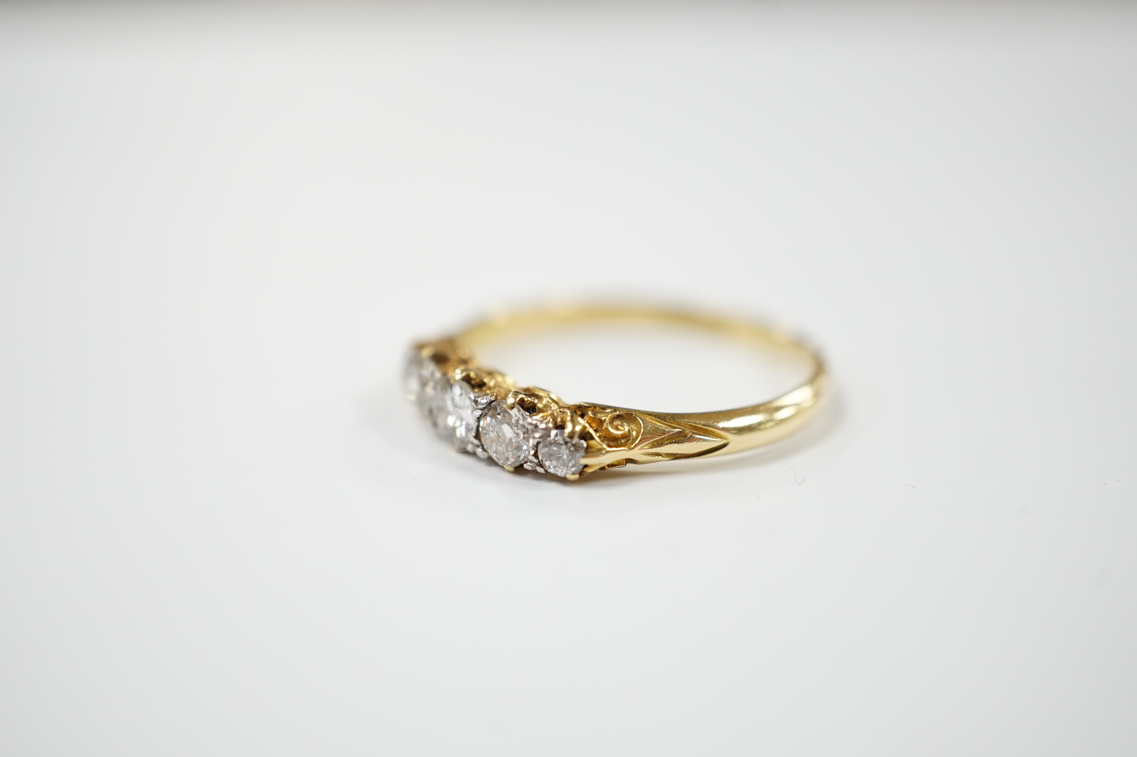 An 18ct and graduated five stone diamond set half hoop ring, size P/Q, gross weight 2.7 grams. - Image 2 of 3