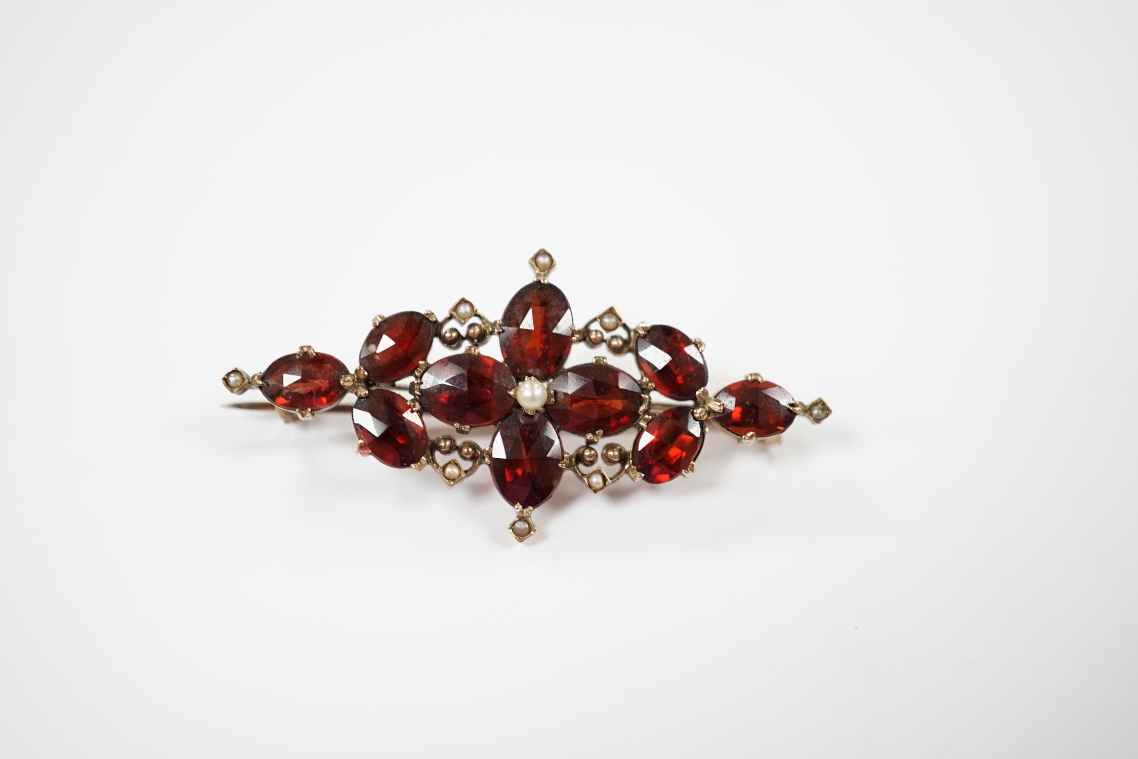 A Victorian yellow metal, garnet and seed pearl cluster set brooch, 44mm, gross weight 4.8 grams. - Image 2 of 3