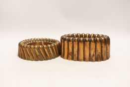 Two Victorian copper jelly moulds, the ring shaped example stamped Baileys hotel and the overall