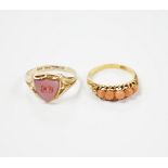 An early 20th century 18ct and graduated five stone split coral bead set half hoop ring, size O