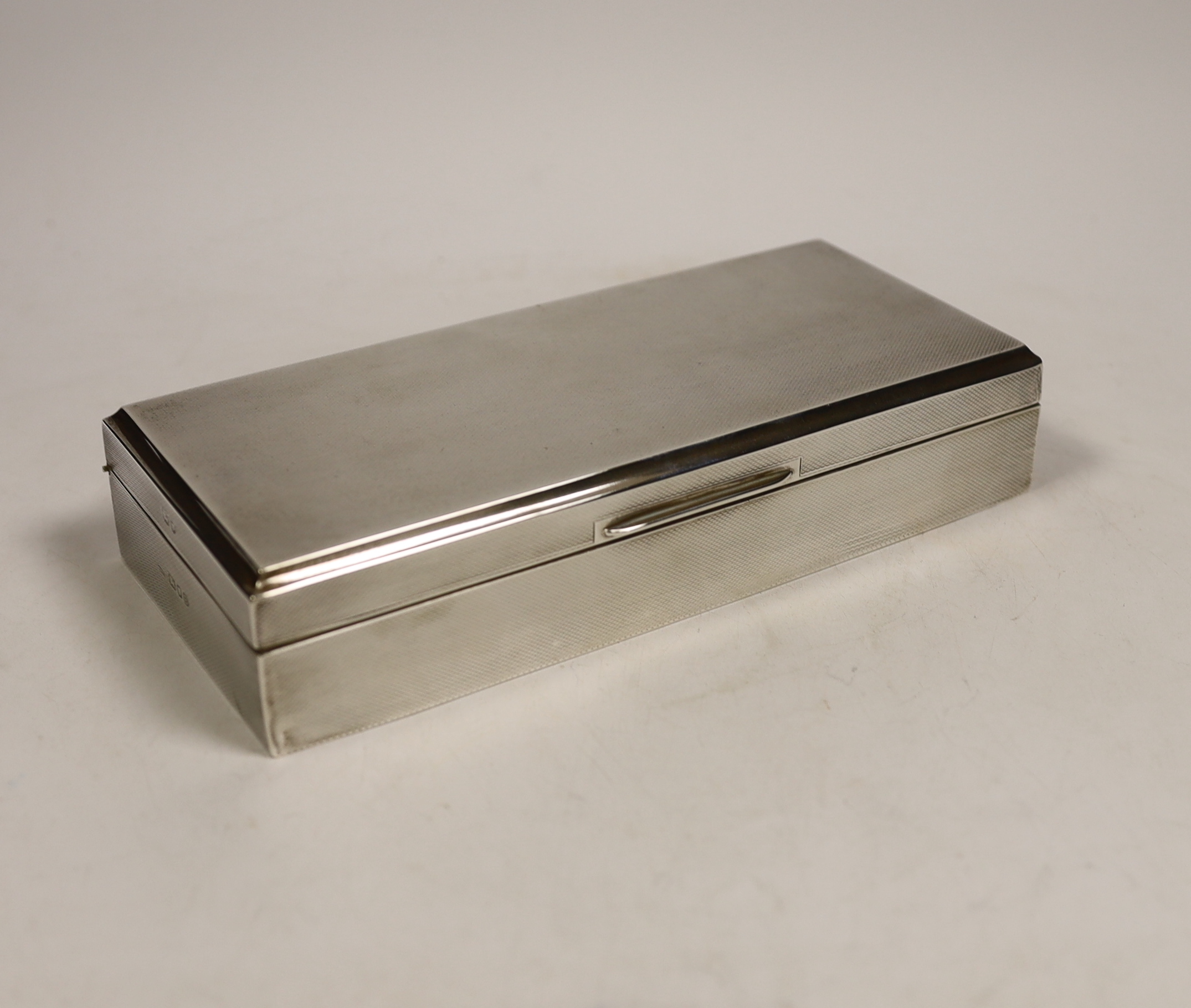 A George VI engine turned silver mounted rectangular cigarette box, Asprey & Co Ltd, London, 1937,