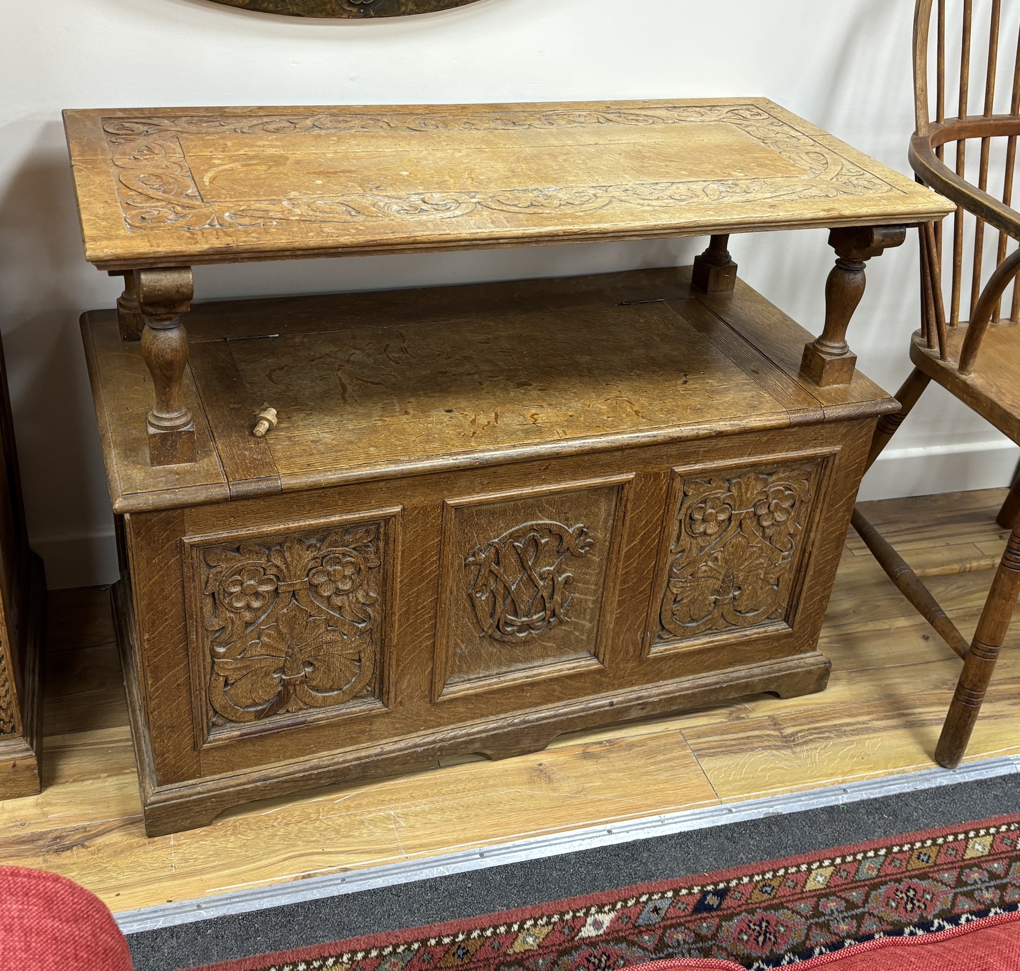 A carved oak monk's bench, width 94cm, depth 44cm, height 70cm