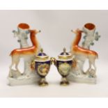 A pair of Coalport vases and covers and a pair of Staffordshire deer spill vases, largest 29cm high