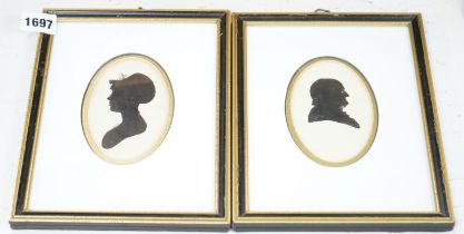A pair of Georgian oval painted silhouette portraits, lady and gentleman, 10 x 6.5cm