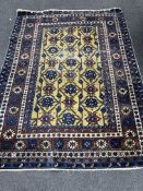 A North West Persian gold ground rug, 150 x 112cm