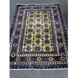 A North West Persian gold ground rug, 150 x 112cm
