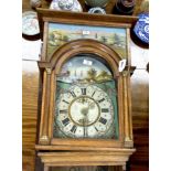 An oak cased Dutch wall clock with arched painted dial, case inset painted landscape panels,