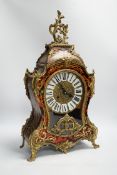 A simulated tortoiseshell Boulle work mantel clock, striking on a bell, 57cm high