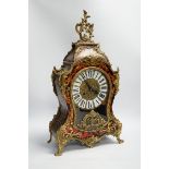 A simulated tortoiseshell Boulle work mantel clock, striking on a bell, 57cm high