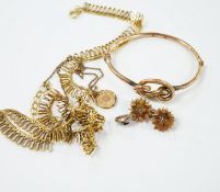 A 9ct. gold fringe necklace, 49cm(a.f.) a 9ct. gold bangle, 25.9 grams, a gold plated locket on a