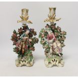 A pair of Chelsea figural candlesticks, c.1765, 30cm