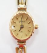 A lady's 9ct quartz wrist watch, on a 9ct gold bracelet, overall length 18cm, gross weight 8.9