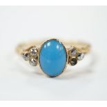 A yellow metal and single stone cabochon turquoise set ring, with six stone diamond set shoulders (