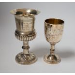 A small modern silver goblet, 11.2cm. and one other larger white metal goblet.