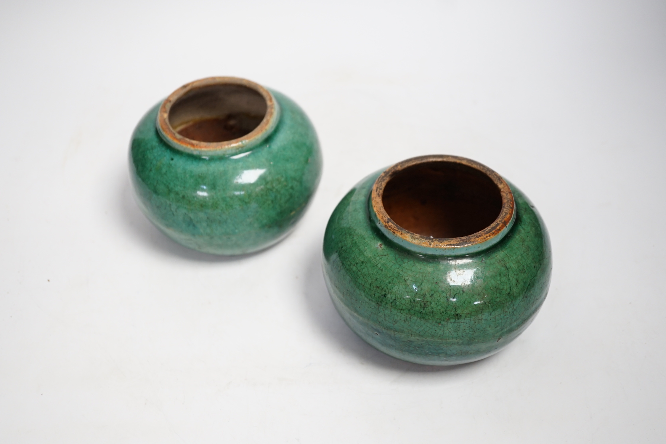 A pair of Chinese pottery monochrome green glazed jars, 10cm high - Image 2 of 4