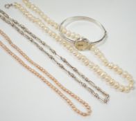 A modern 925 chain, a lady's 925 bangle watch and two cultured pearl necklaces.