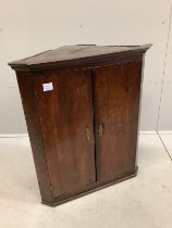 A George III oak hanging corner cupboard, width 70cm, depth 41cm, height 82cm