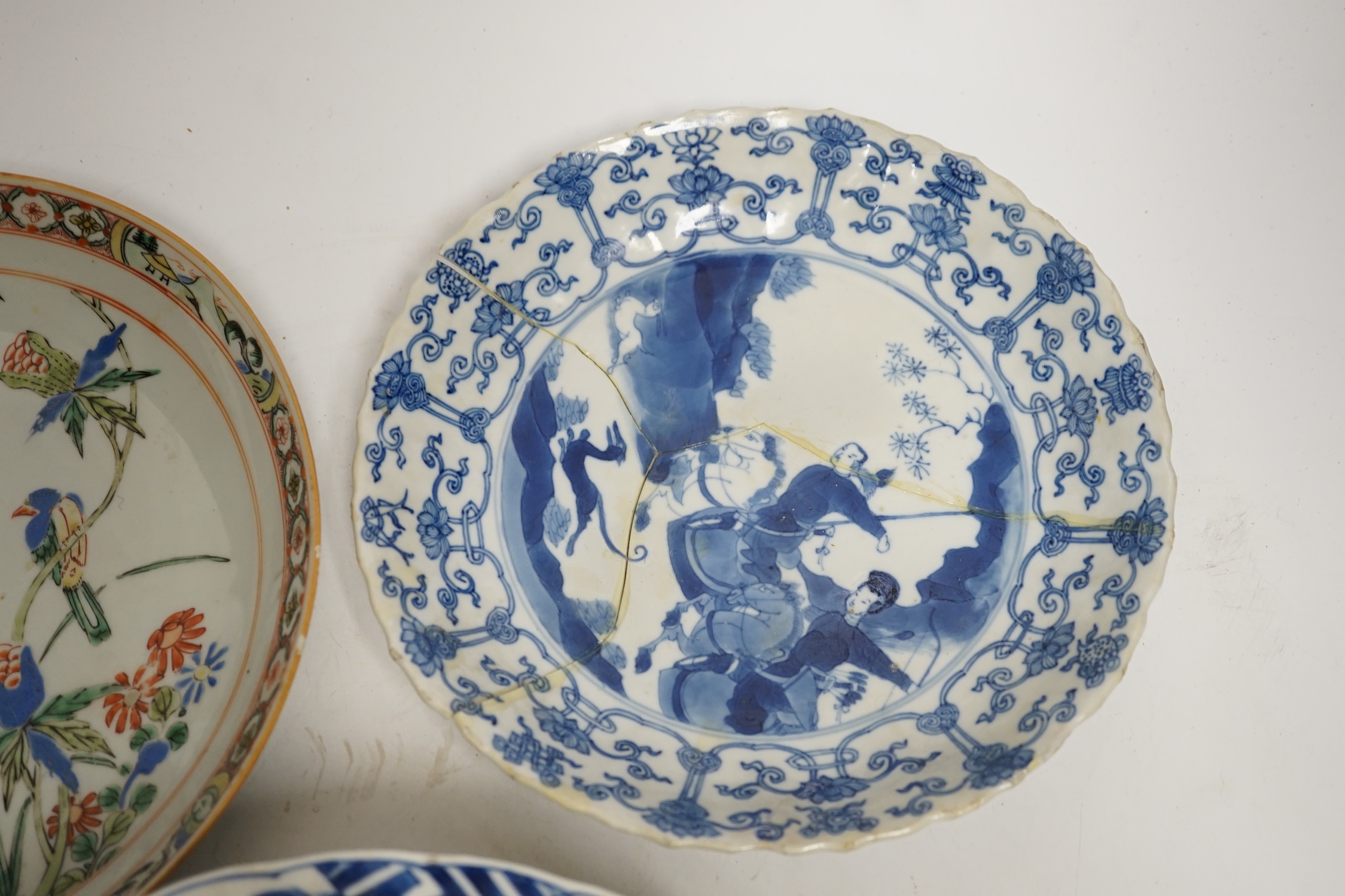 A Chinese blue and white ‘warriors’ bowl, Kangxi mark and period, a similar ‘hunting’ saucer dish, - Image 3 of 8