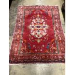 A Turkish red ground rug, 150 x 106cm