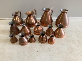 Fourteen 19th / early 20th century copper haystack measures, half gallon to one gill, largest height