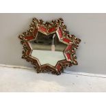 A giltwood and composition star shaped wall mirror, width 78cm