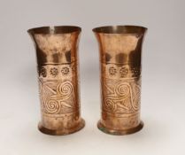 A pair of Keswick School of industrial art embossed copper cylinder vases, stamped KSIA to the