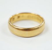 A 22ct. gold wedding band, size N, 7.2 grams.