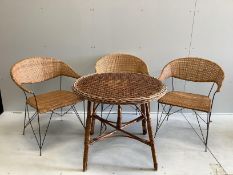 A circular wicker table, diameter 83cm, height 70cm together with three wicker tub framed chairs